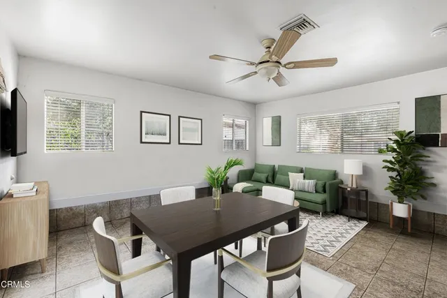 a aerial view of a house with a yard and plants