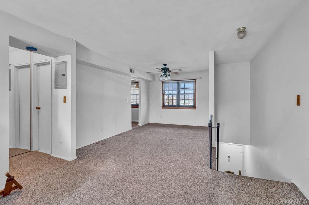 228 Mariners Way Copiague, NY 11726 - Photo 4 of 15 looking into DR, Hall & Downstairs