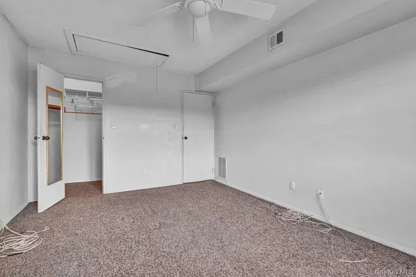 a utility room with cabinets washer and dryer