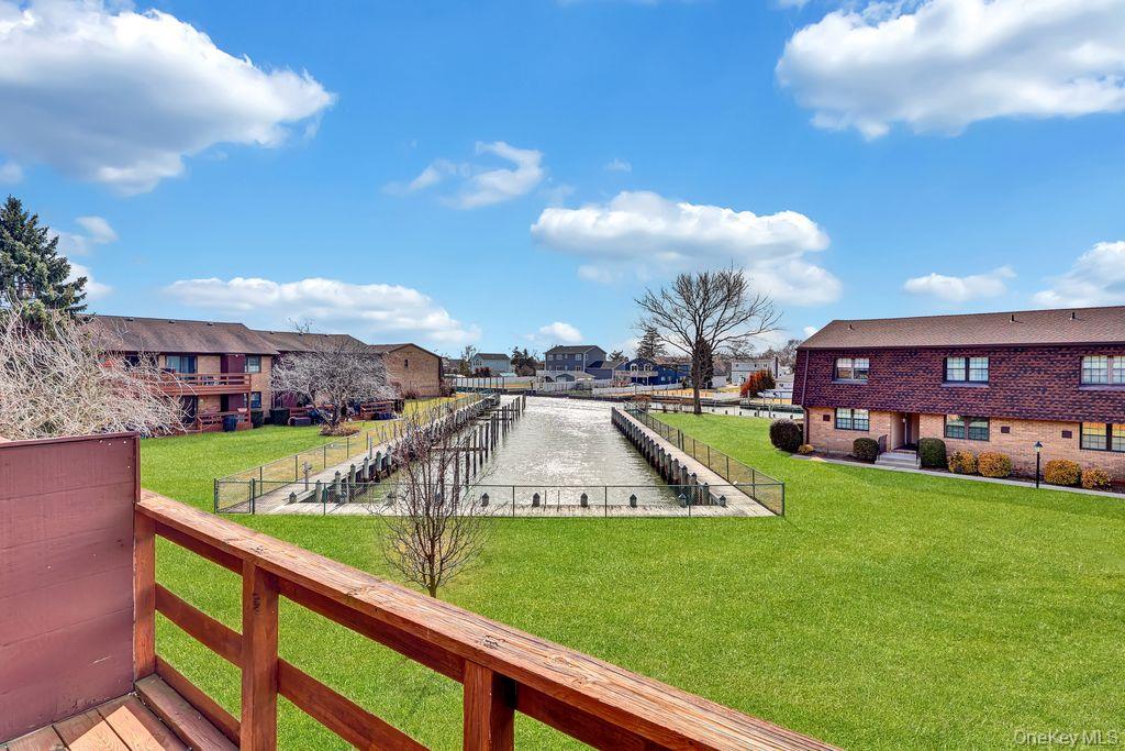 228 Mariners Way Copiague, NY 11726 - Photo 9 of 15 On the Deck, Looking right up the Canal!