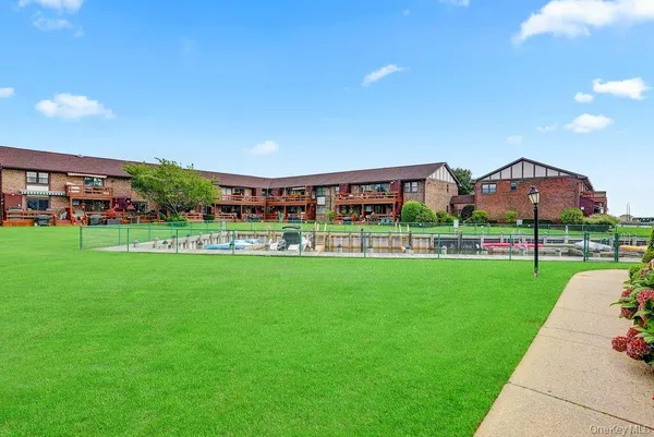a view of a lake with boats and trees in the background