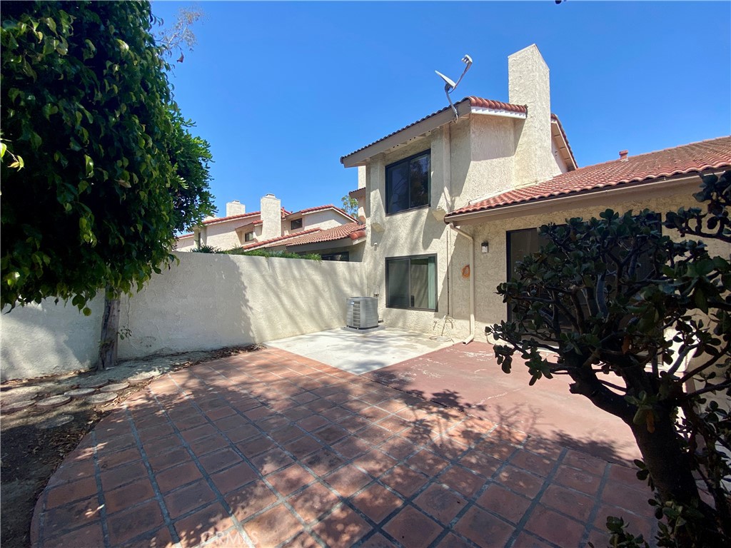 809 Creekside Drive, Unit 35 Fullerton, CA 92833 - Photo 22 of 23 a view of a house with a snow in the yard
