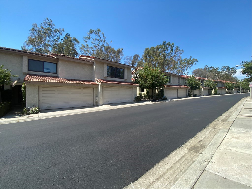 809 Creekside Drive, Unit 35 Fullerton, CA 92833 - Photo 3 of 23 a view of a street with a building in the background