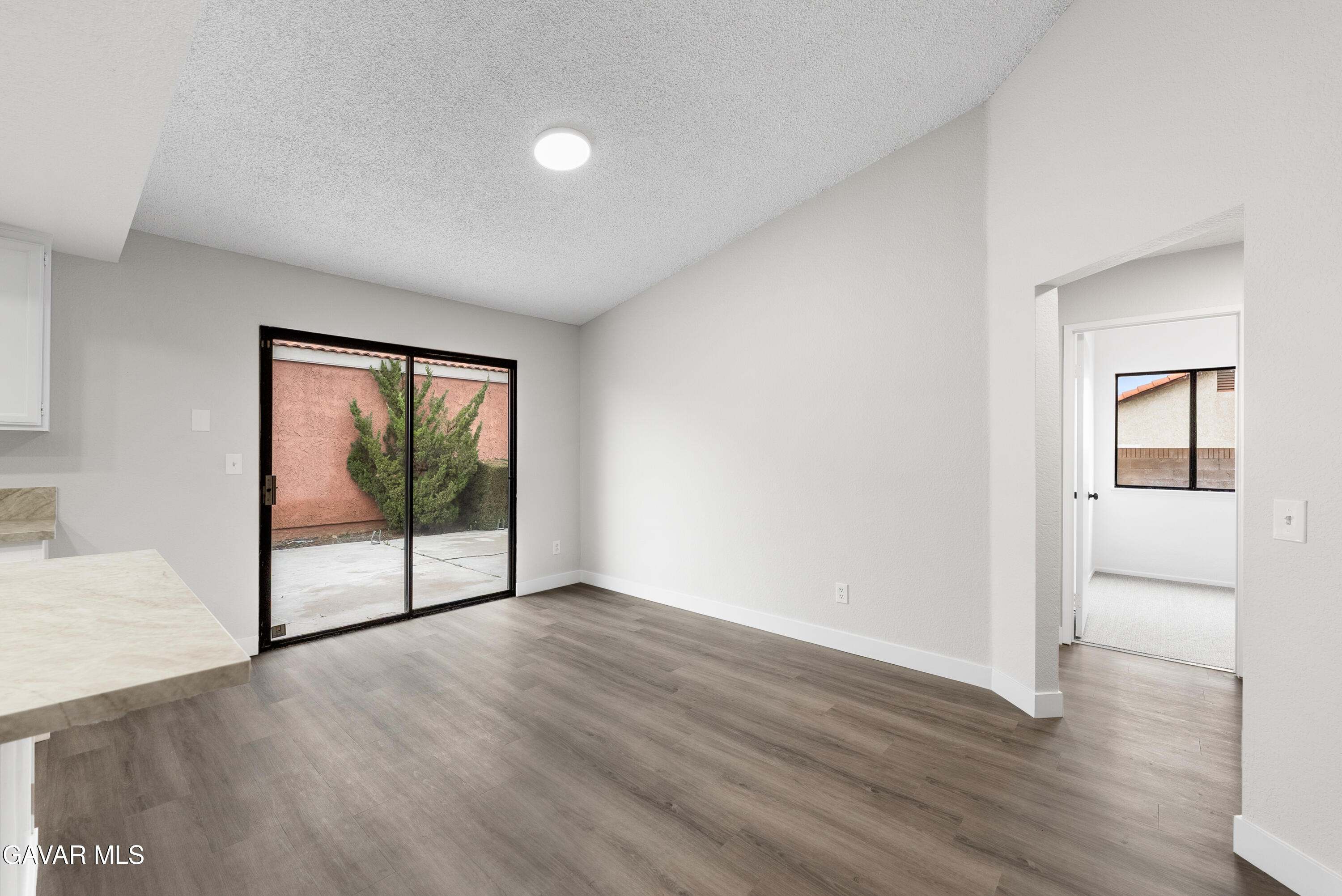 3563 Avenue R11 E Palmdale Ca East Palmdale, CA 93550 - Photo 20 of 37 an empty room with wooden floor and windows