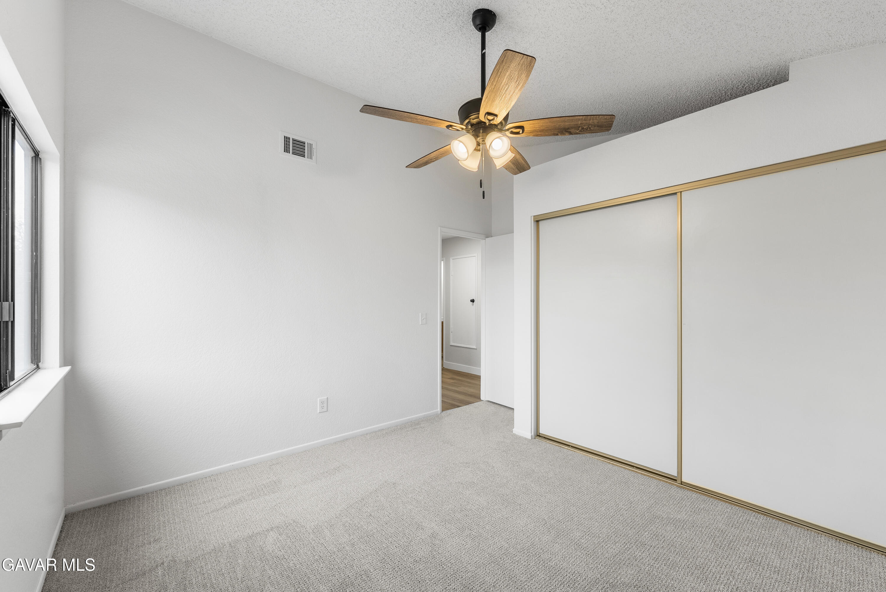 3563 Avenue R11 E Palmdale Ca East Palmdale, CA 93550 - Photo 28 of 37 an empty room with a fan and a fan