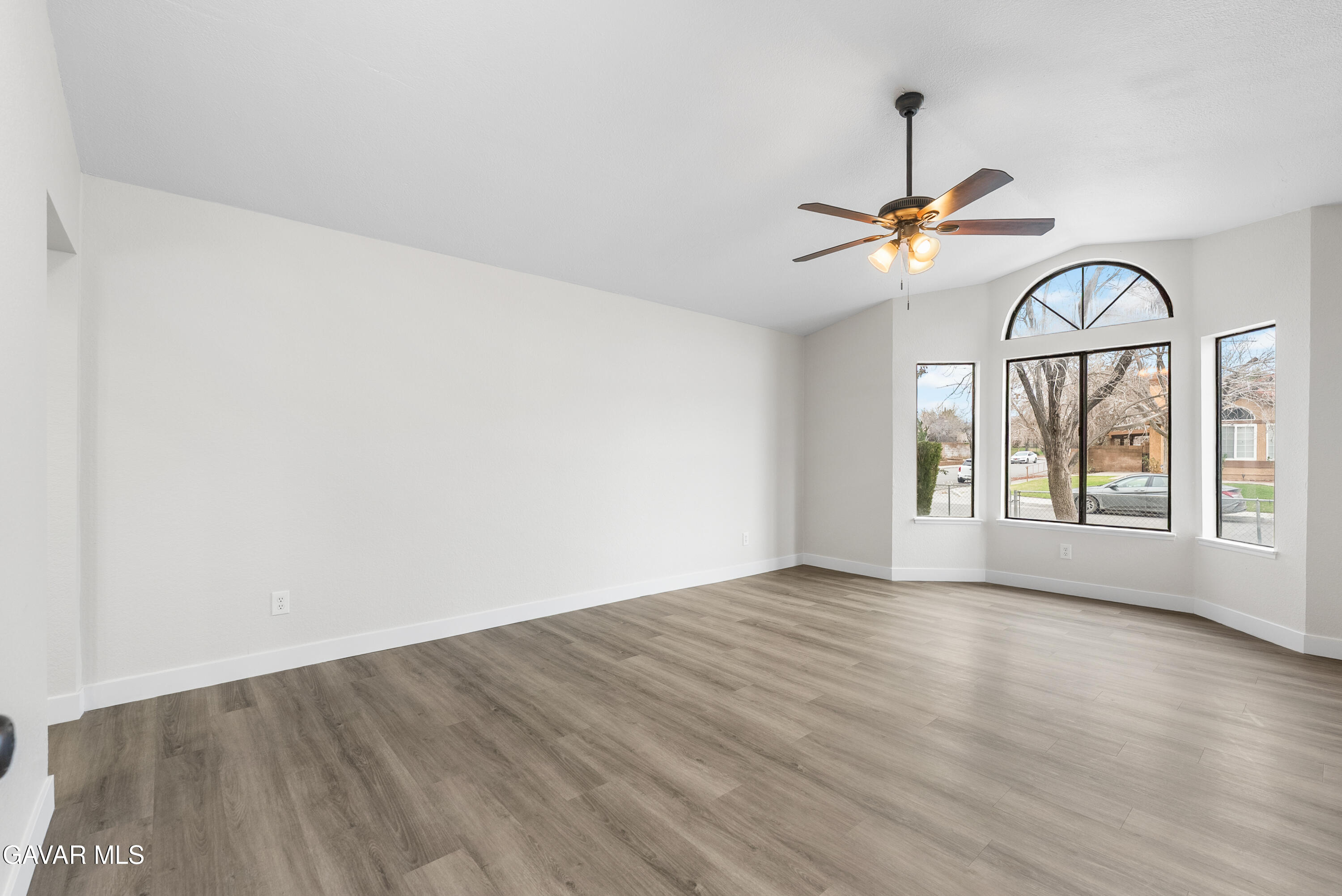3563 Avenue R11 E Palmdale Ca East Palmdale, CA 93550 - Photo 7 of 37 wooden floor in an empty room with a window