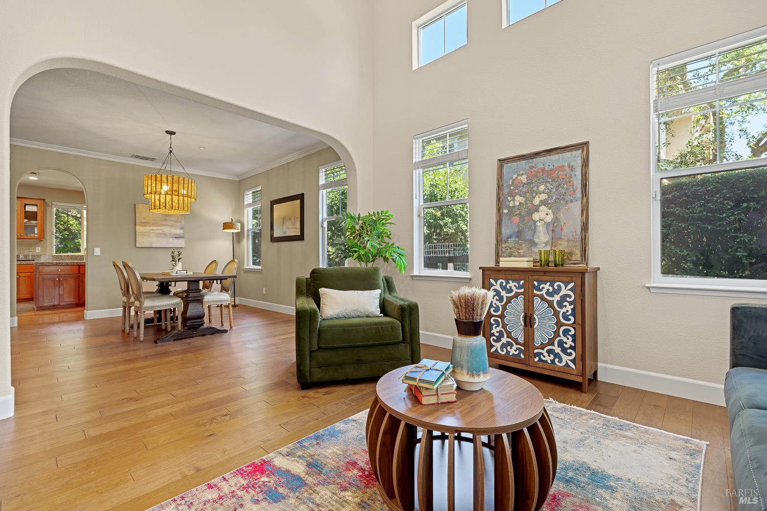 68 Pinheiro Circle Novato, CA 94945 - Photo 4 of 82 The spacious living and dining areas flow seamlessly together, creating an inviting setting for everyday living and entertaining. Large windows fill the home with natural light while highlighting the updated engineered maple flooring.