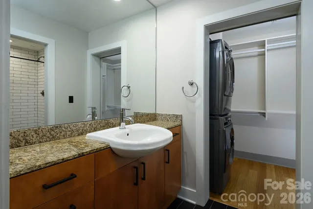 a view of walk in closet with empty racks