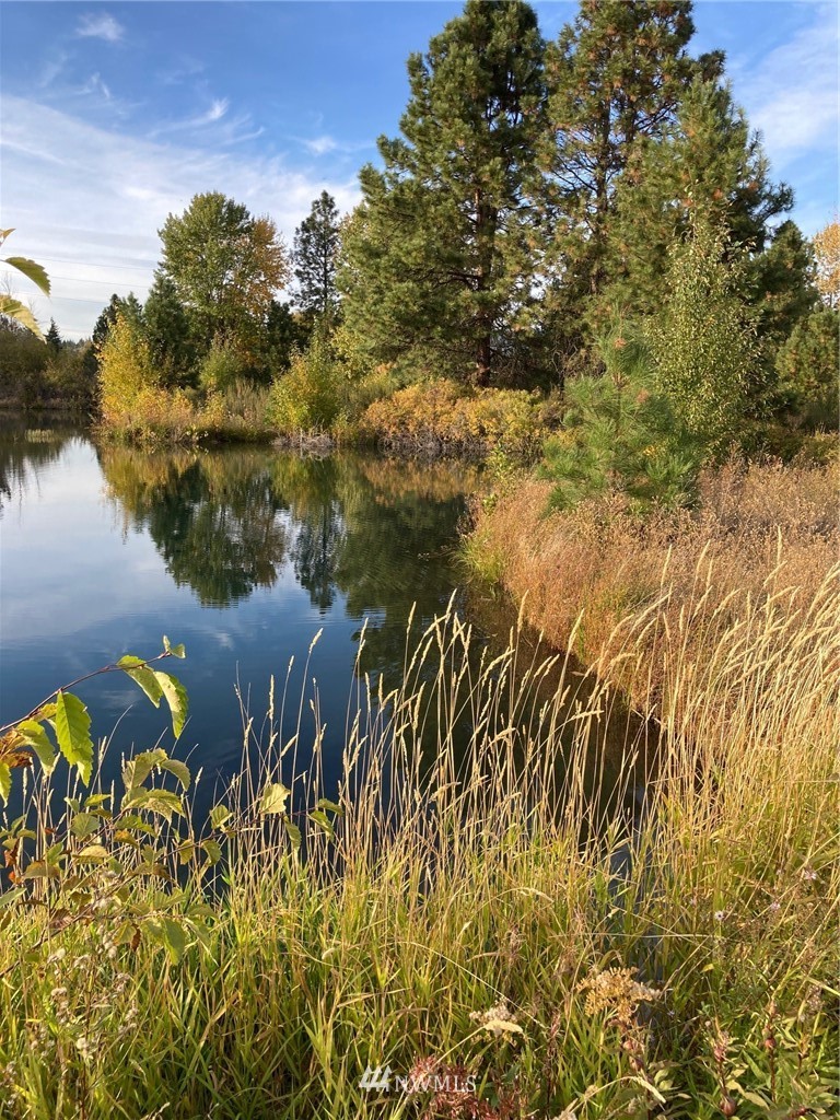 0 Westside Road Cle Elum, WA 98922 - Photo 16 of 31 a view of a lake with lawn chairs