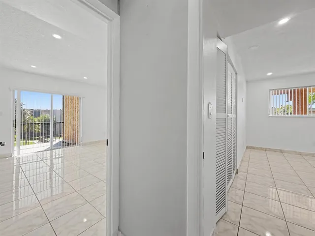 a view of livingroom with an empty space and window