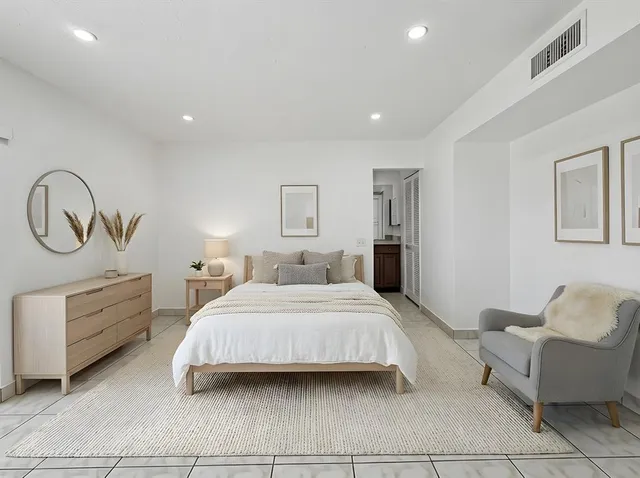 a bedroom with a bed and furniture