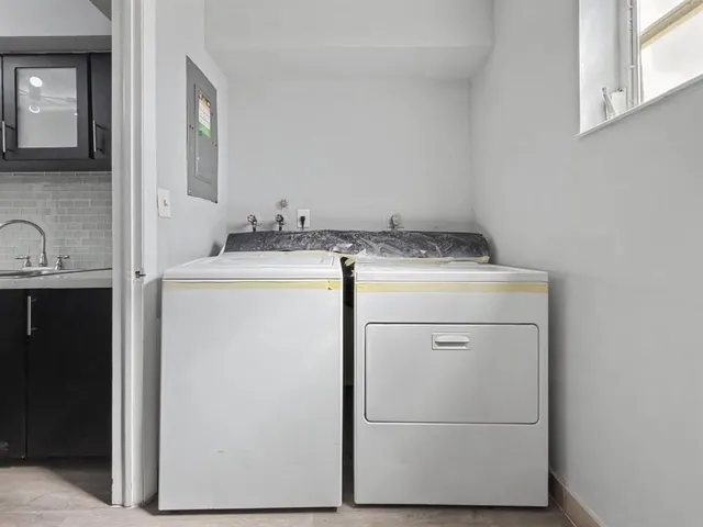 a utility room with dryer and washer