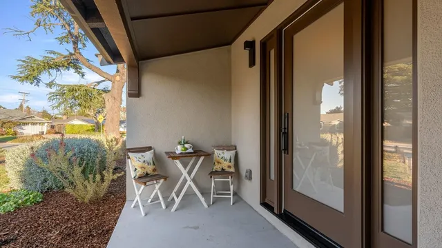 a living room with furniture a window and a table