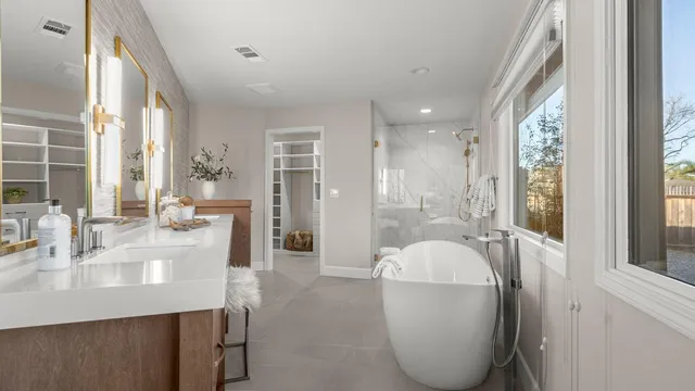 a bathroom with a bathtub and shower