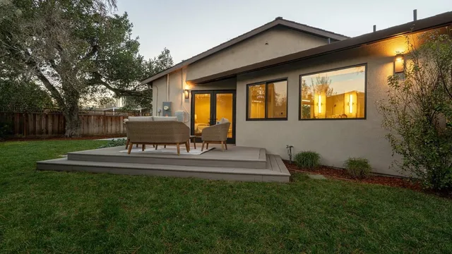 a view of backyard with patio