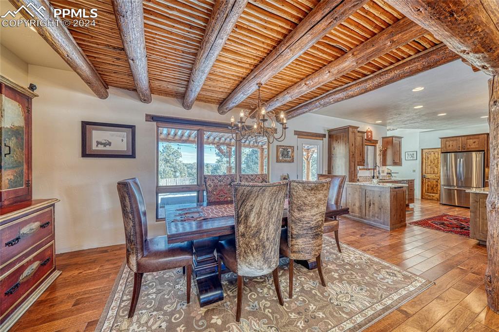 1328 Round Up Road Westcliffe, CO 81252 - Photo 11 of 50 a view of a dining room with furniture window and wooden floor