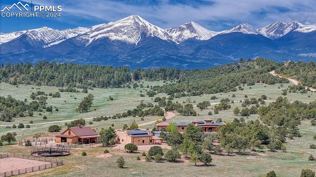 1328 Round Up Road Westcliffe, CO 81252 - Photo 2 of 50 a view of a town with mountains in the background