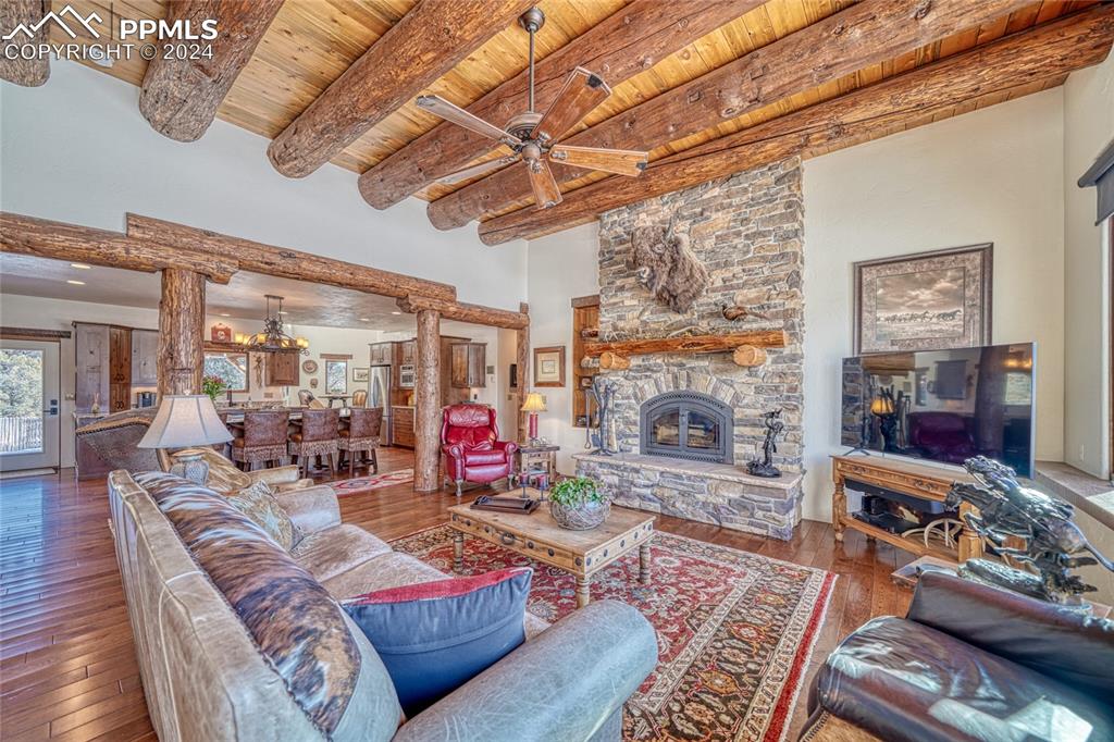 1328 Round Up Road Westcliffe, CO 81252 - Photo 21 of 50 a living room with furniture and a fireplace