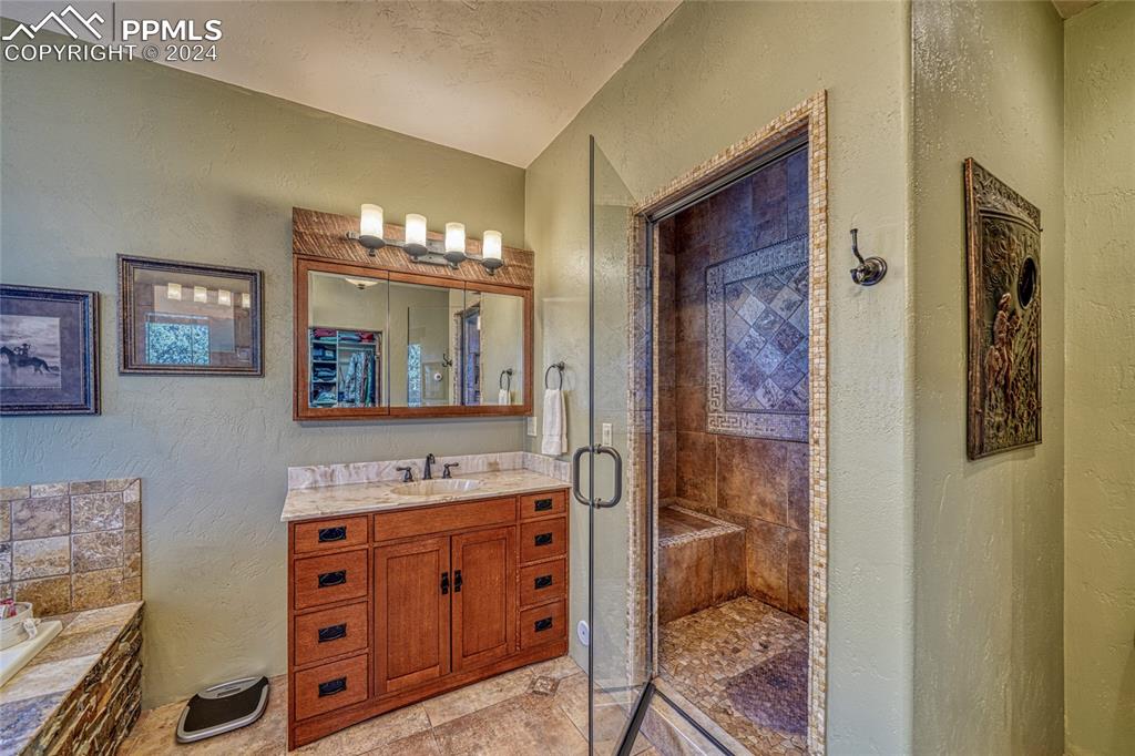 1328 Round Up Road Westcliffe, CO 81252 - Photo 28 of 50 a bathroom with a double vanity sink and a mirror