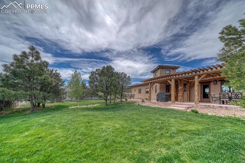 1328 Round Up Road Westcliffe, CO 81252 - Photo 47 of 50 a front view of a house with a garden and trees
