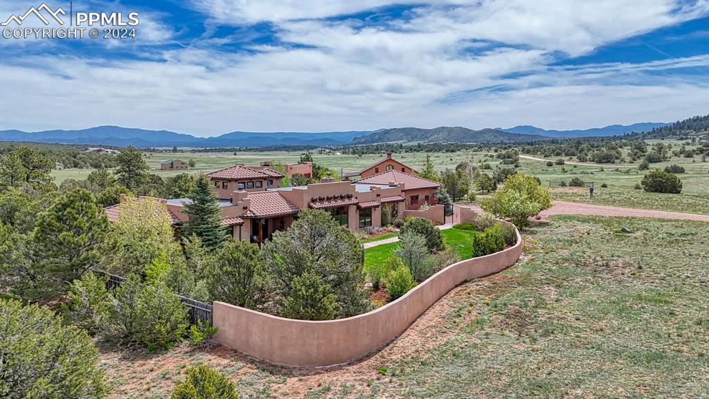 1328 Round Up Road Westcliffe, CO 81252 - Photo 5 of 50 a view of a swimming pool with an outdoor seating