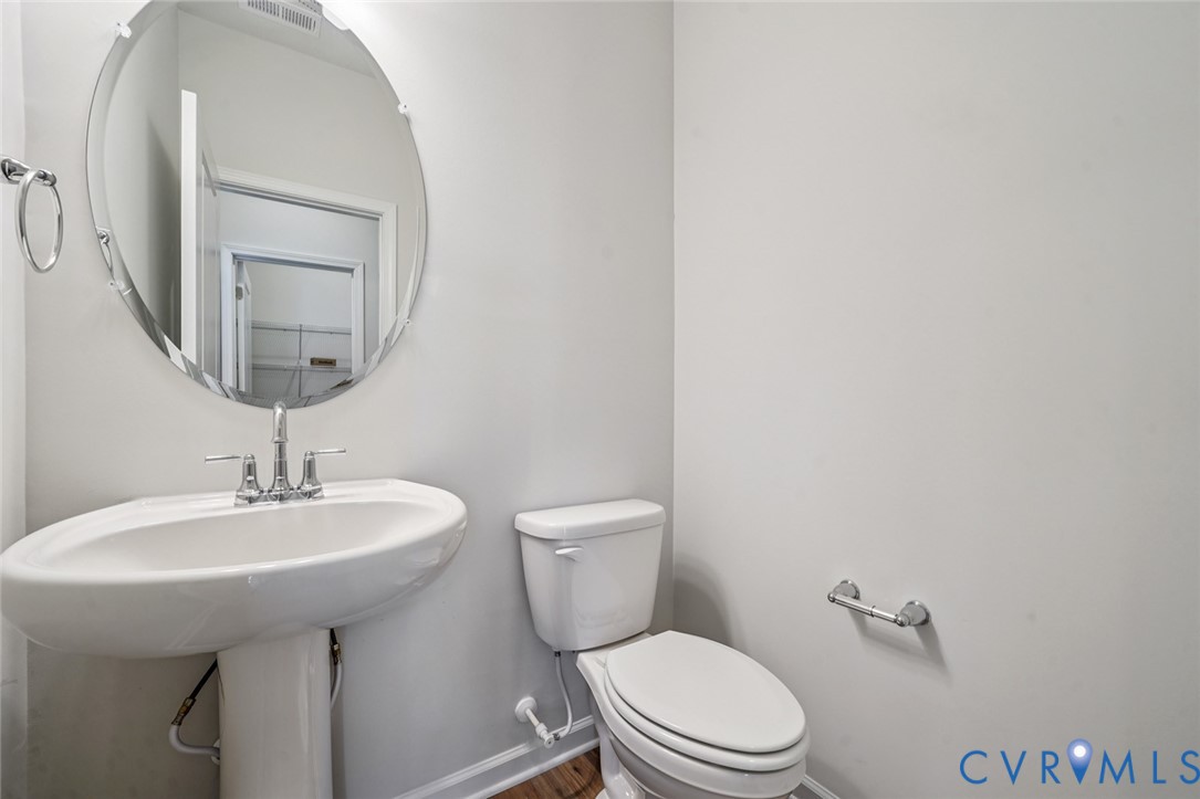 344 Mt Mccauley Way Aylett, VA 23009 - Photo 22 of 33 a bathroom with a sink a mirror and a toilet