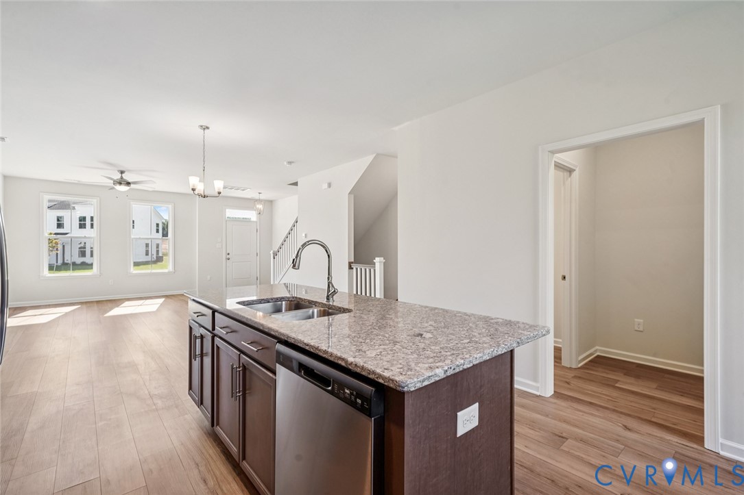 344 Mt Mccauley Way Aylett, VA 23009 - Photo 5 of 33 an open kitchen with granite countertop sink and refrigerator