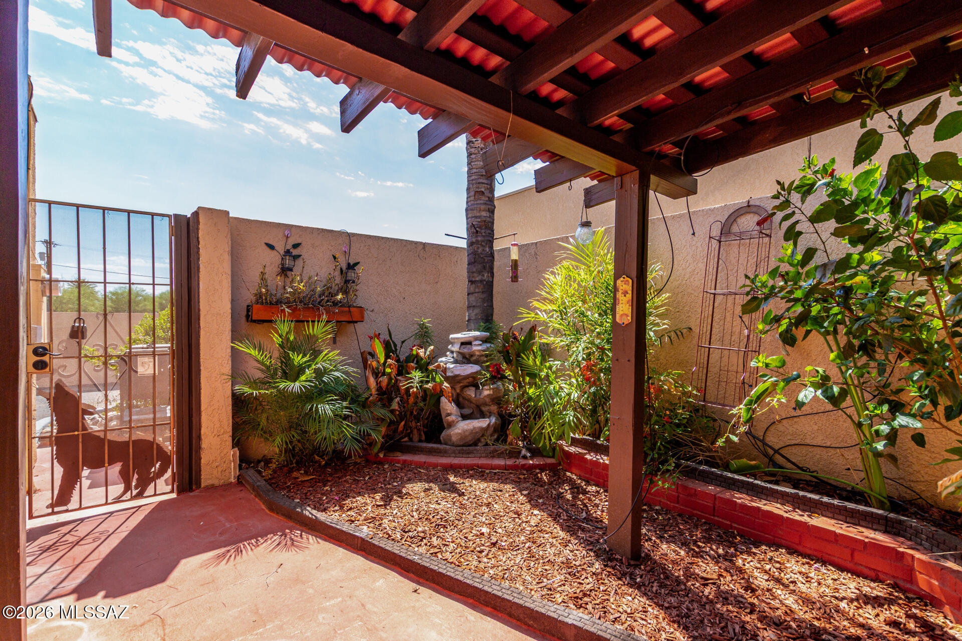 3781 East Edison Street Tucson, AZ 85716 - Photo 24 of 28 a view of a porch with a potted plant