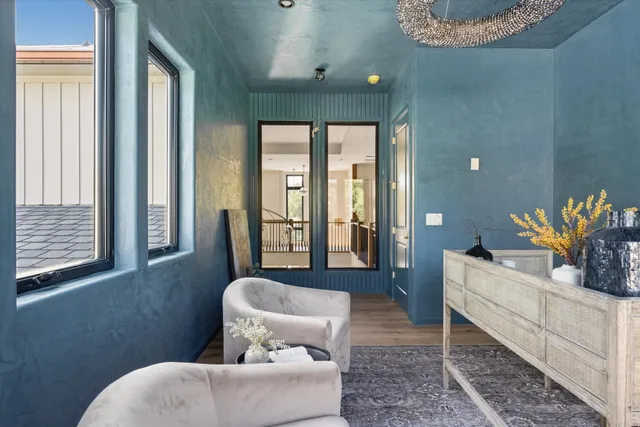 a bathroom with a glass door shower and a sink
