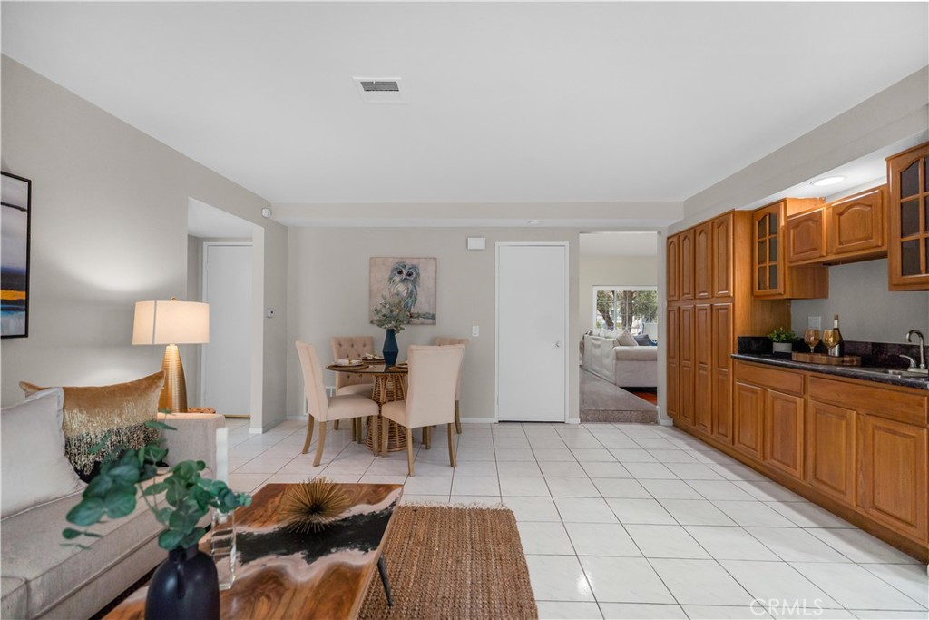 697 Farben Drive Diamond Bar, CA 91765 - Photo 20 of 54 a kitchen with stainless steel appliances a table and chairs in it