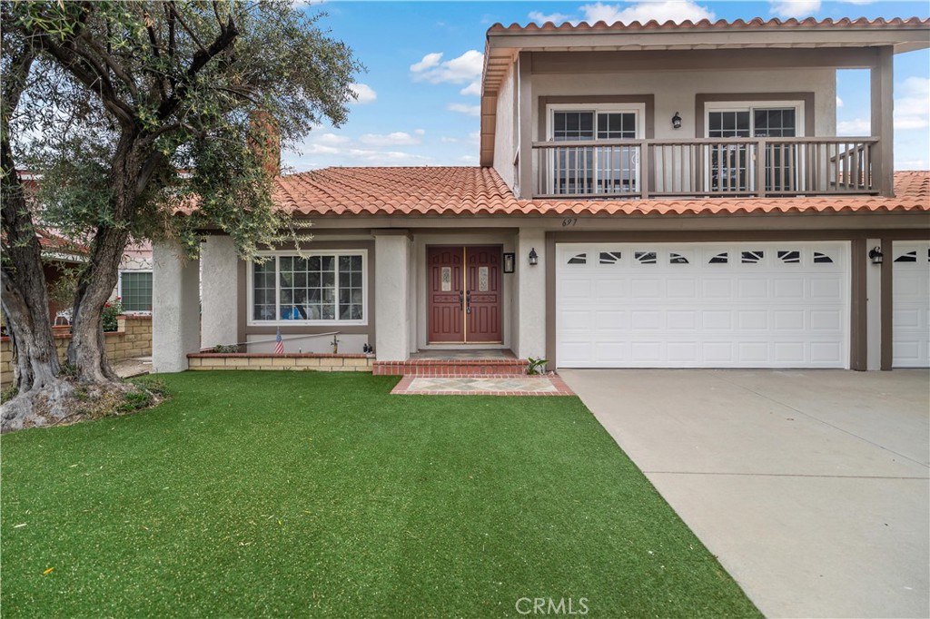 697 Farben Drive Diamond Bar, CA 91765 - Photo 2 of 54 a view of a house with a backyard