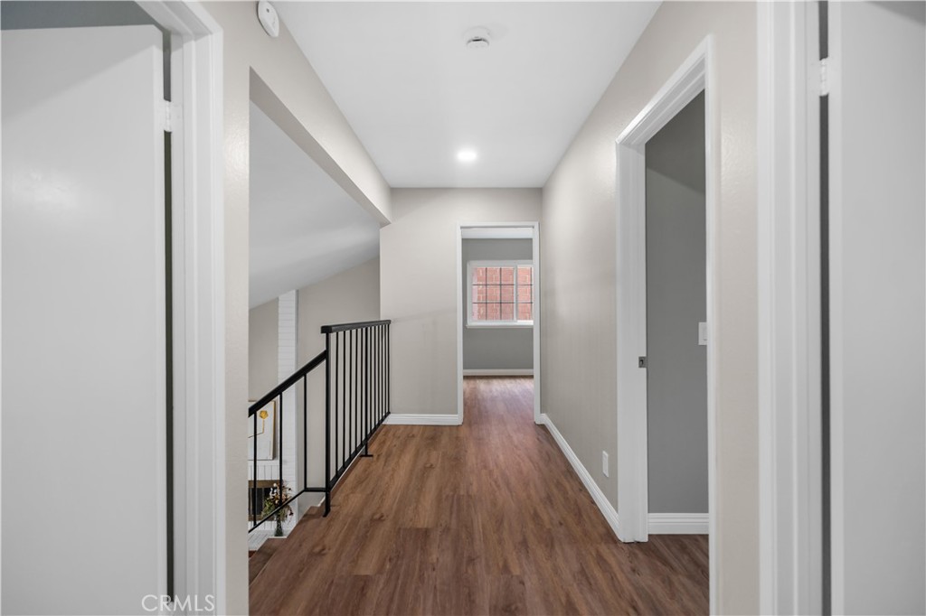 697 Farben Drive Diamond Bar, CA 91765 - Photo 28 of 54 a view of a hallway with wooden floor