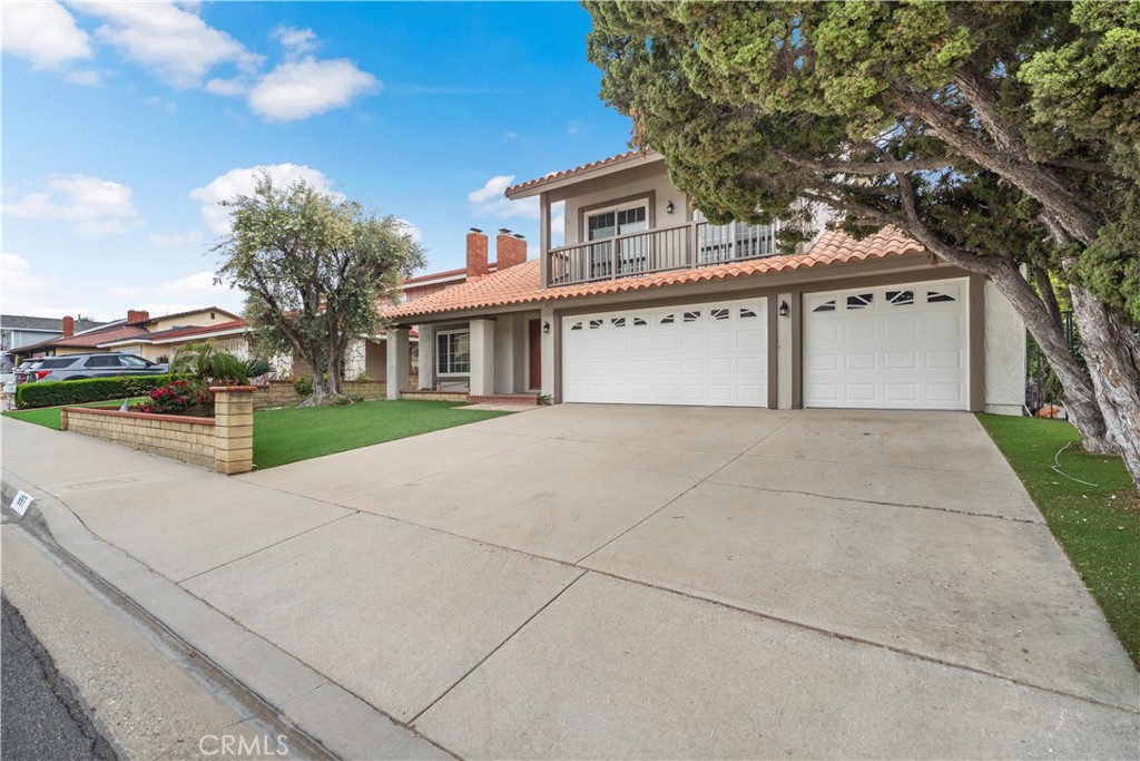 697 Farben Drive Diamond Bar, CA 91765 - Photo 3 of 54 a white house that has tree in front of it