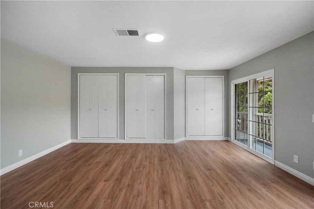 697 Farben Drive Diamond Bar, CA 91765 - Photo 32 of 54 wooden floor in an empty room with a window