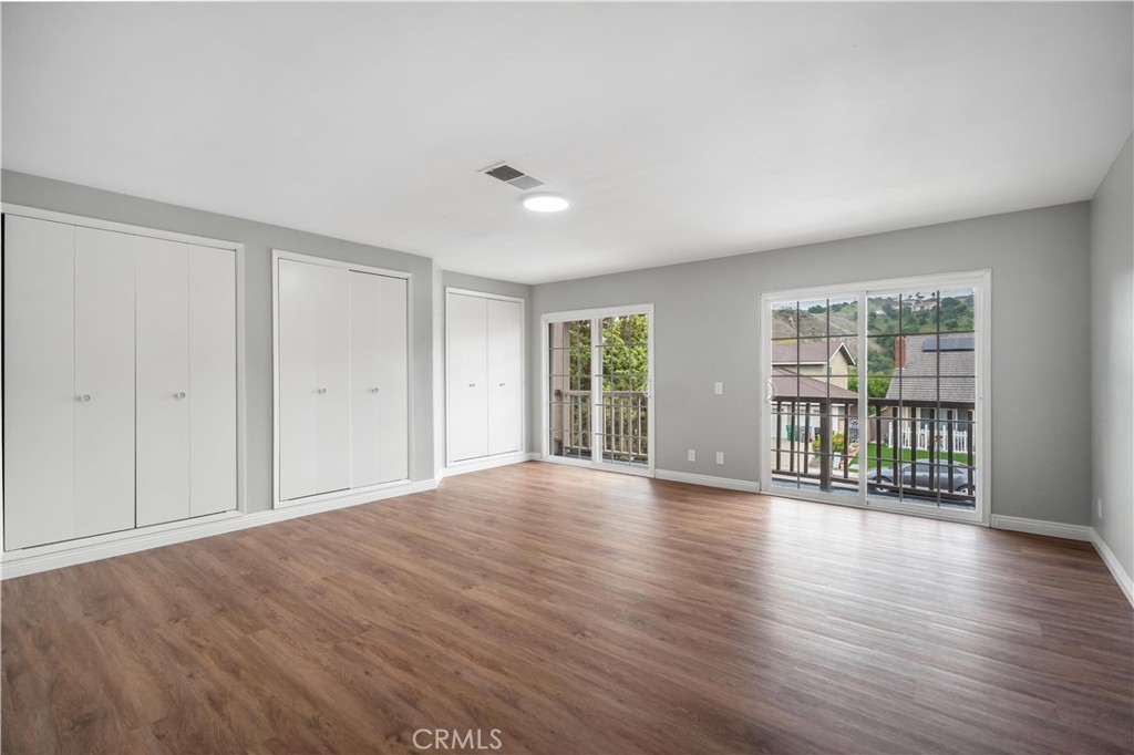 697 Farben Drive Diamond Bar, CA 91765 - Photo 33 of 54 a view of an empty room with wooden floor and a window