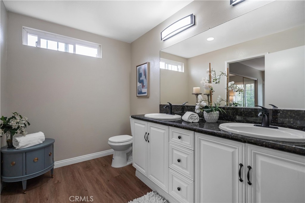 697 Farben Drive Diamond Bar, CA 91765 - Photo 38 of 54 a bathroom with a double vanity sink and a mirror