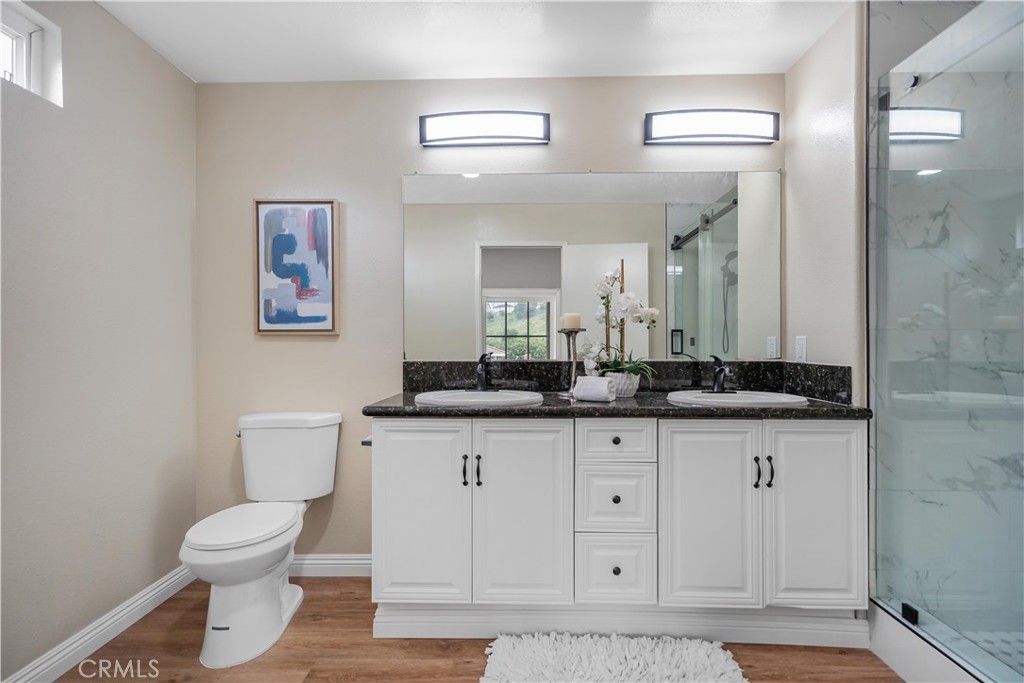 697 Farben Drive Diamond Bar, CA 91765 - Photo 39 of 54 a bathroom with a toilet a sink and mirror