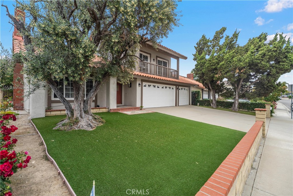 697 Farben Drive Diamond Bar, CA 91765 - Photo 4 of 54 a front view of a house with garden