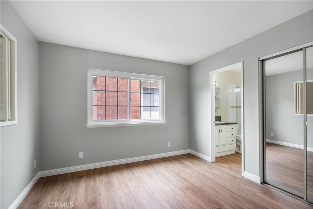 697 Farben Drive Diamond Bar, CA 91765 - Photo 44 of 54 an empty room with wooden floor and windows