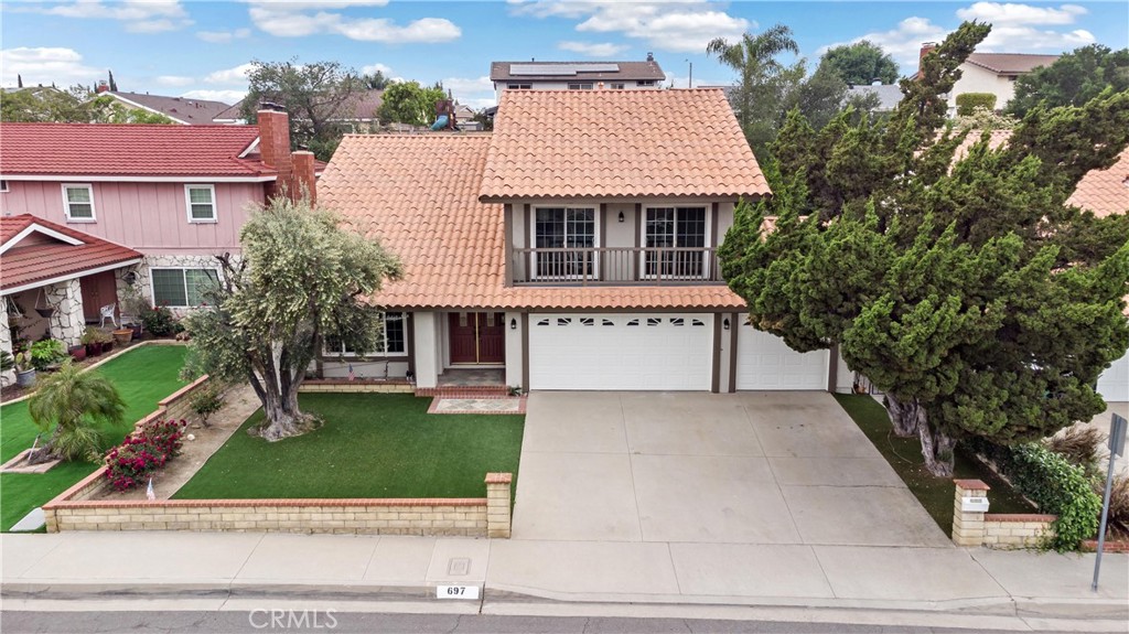 697 Farben Drive Diamond Bar, CA 91765 - Photo 5 of 54 front view of house with a yard