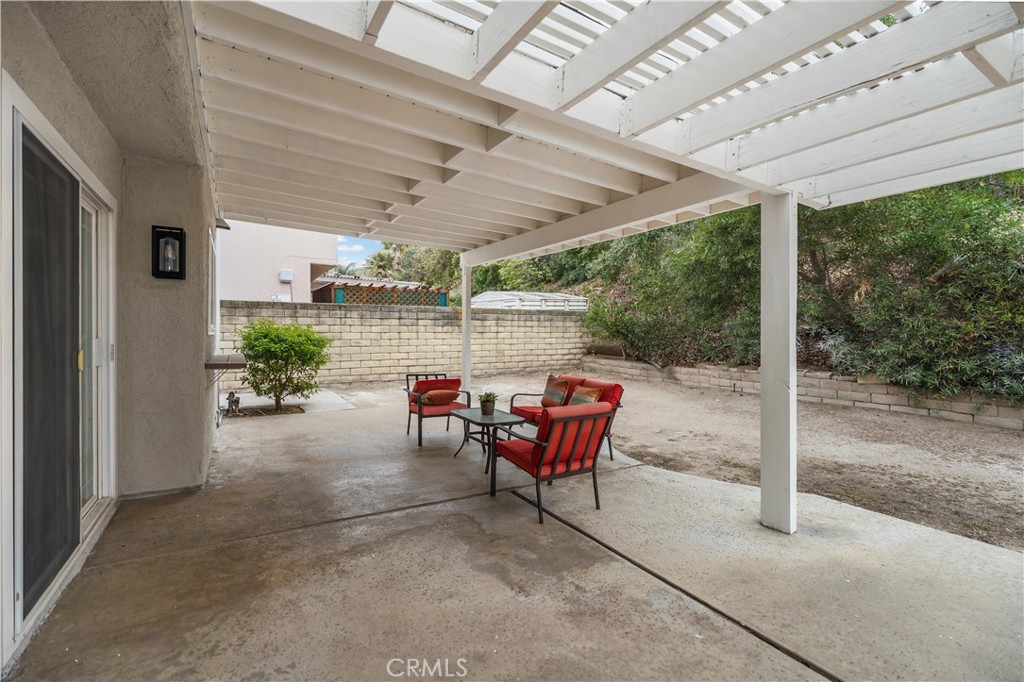 697 Farben Drive Diamond Bar, CA 91765 - Photo 54 of 54 a view of a patio with table and chairs next to a yard