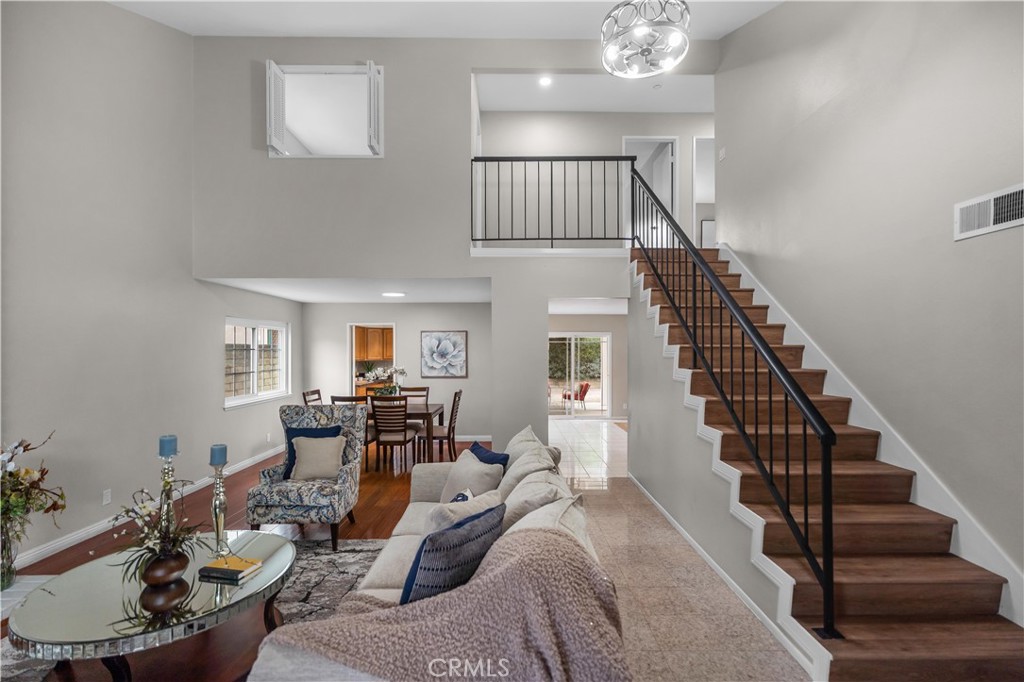 697 Farben Drive Diamond Bar, CA 91765 - Photo 10 of 54 a living room with furniture or dining table and a chandelier