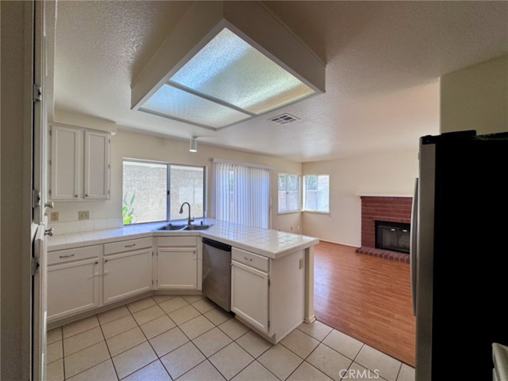 31585 Corte Salinas Temecula, CA 92592 - Photo 13 of 42 a kitchen with a sink stainless steel appliances and cabinets