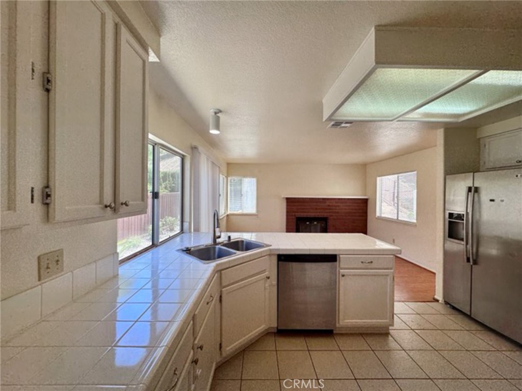 31585 Corte Salinas Temecula, CA 92592 - Photo 16 of 42 a kitchen with a sink appliances and cabinets
