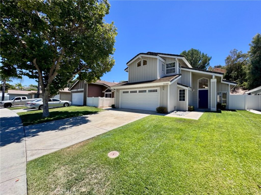 31585 Corte Salinas Temecula, CA 92592 - Photo 3 of 42 a front view of house with yard and green space