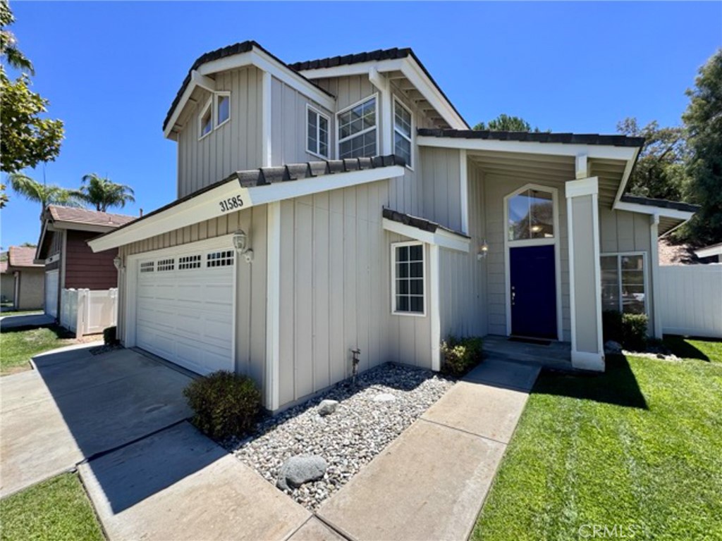 31585 Corte Salinas Temecula, CA 92592 - Photo 5 of 42 a front view of a house with a yard