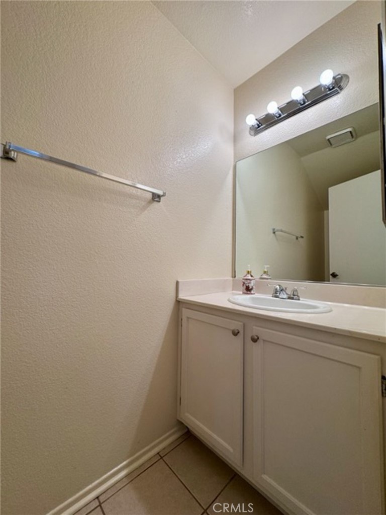 31585 Corte Salinas Temecula, CA 92592 - Photo 9 of 42 a bathroom with a sink and mirror