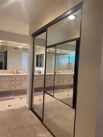 a bathroom with a tub sink and a window