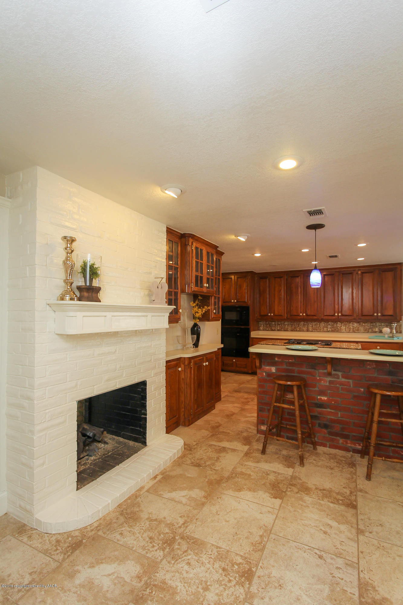 7915 Santa Fe Trail Amarillo, TX 79110 - Photo 17 of 57 a open kitchen with a table and chairs