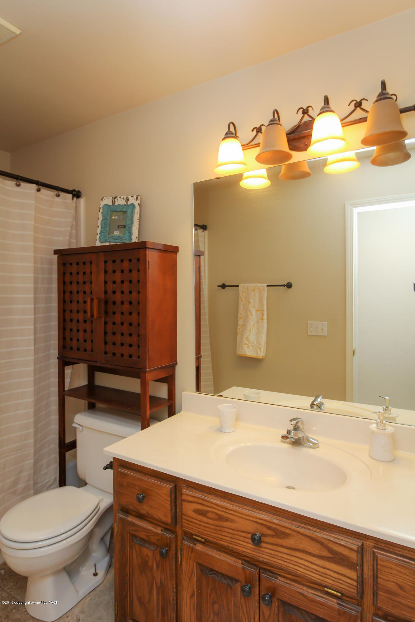 7915 Santa Fe Trail Amarillo, TX 79110 - Photo 20 of 57 a bathroom with a sink and a toilet